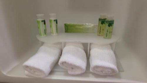 a group of rolled towels in a refrigerator at Holiday Inn Express & Suites Round Rock Austin North, an IHG Hotel in Round Rock