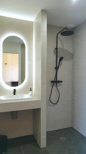 a bathroom with a sink and a mirror at Mas Labrugade in Lebreil