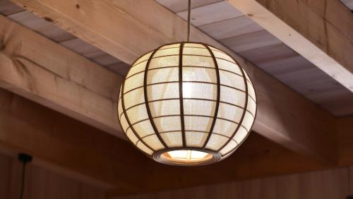 a light fixture hanging from a ceiling at Mas Labrugade in Lebreil