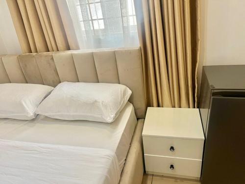 Ένα ή περισσότερα κρεβάτια σε δωμάτιο στο Lovely and cozy studio in Wuye