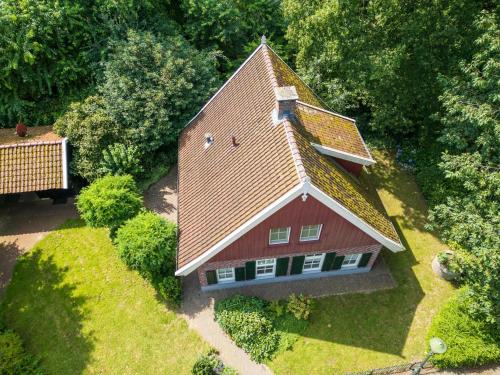 an overhead view of a red house with a roof at de Spil in Winterswijk-Meddo