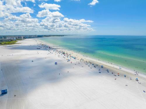 an overhead view of a beach with people in the water at Stunning Ocean-View Penthouse! Spacious, New, in Village, 20 steps to Best Beach! in Siesta Key