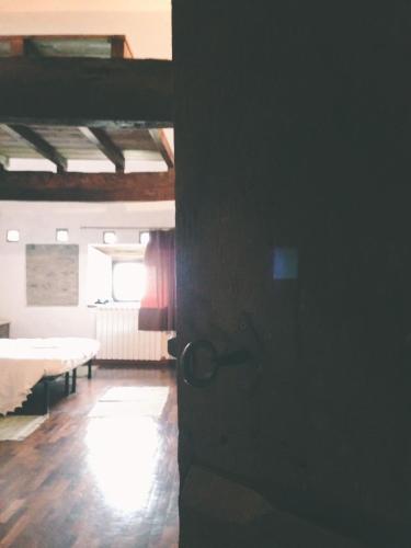 an open door to a room with a bed at B&B Il Tempo Ritrovato in Canossa