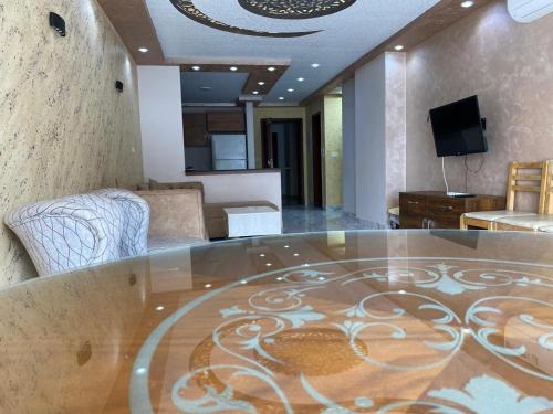 Телевизор и/или развлекательный центр в Porto Said Apartment powered By Amer-Group family only
