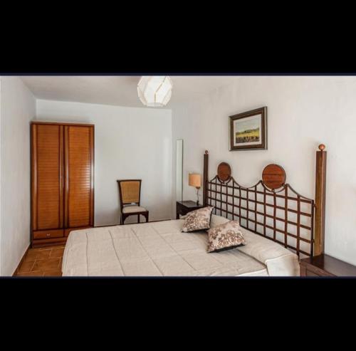 Katil atau katil-katil dalam bilik di Apartamentos Rurales Las Grullas