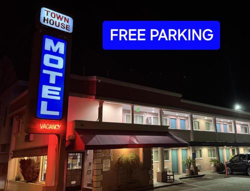 a hotel with a free parking sign in front of it at Town House Motel in San Francisco