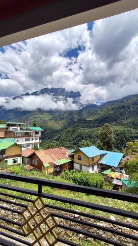 a view of a small town with mountains in the background at Mantra Inn Lachung in Lachung