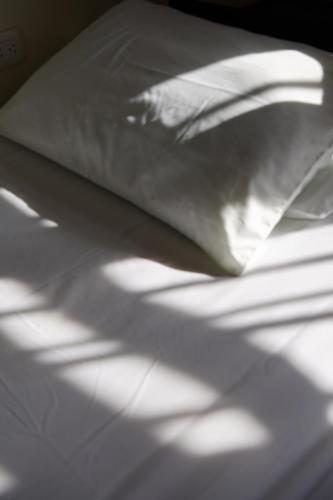 Ein Bett oder Betten in einem Zimmer der Unterkunft Hostal Don Cenobio