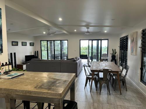a living room with a table and a couch at Stonewood Views in Diwan