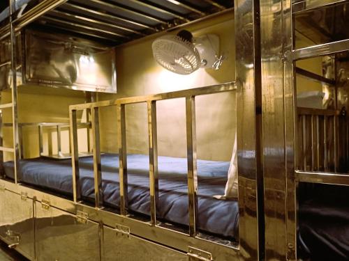 a bunk bed room with two bunk beds in it at The Aroma Backpackers in Mumbai
