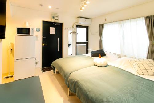 Ένα ή περισσότερα κρεβάτια σε δωμάτιο στο FIKA Shibuya Honmachi 201