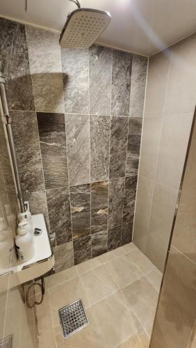 a bathroom with a shower and a sink at Let's Stay in Seoul