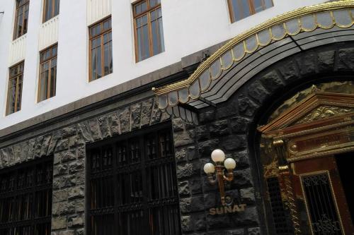 an entrance to a building with a sign on it at Apartamento en Centro Historico de Lima in Lima