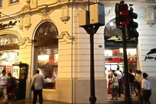 a group of people walking in front of a store at Apartamento en Centro Historico de Lima in Lima