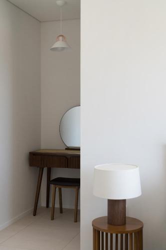 a table and a lamp in a room at Soye stay in Gyeongju