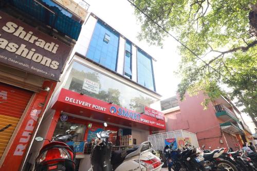 a group of motorcycles parked in front of a store at Hotel O Silver House Near Mantri Square Mall in Bengaluru