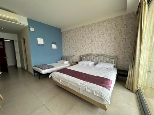 Ein Bett oder Betten in einem Zimmer der Unterkunft Matsu Star Yang Homestay