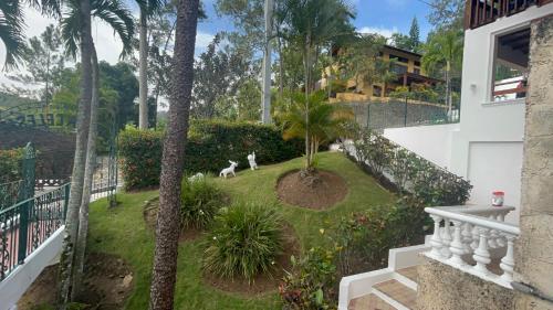 a view from the balcony of a house with a yard at Villa Celeste Bed & Breakfast in El Río Arriba