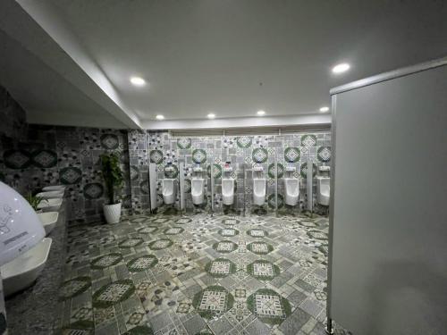 a bathroom with a bunch of toilets in a room at Khu Du Lịch Tea Bobla Waterfall in Di Linh