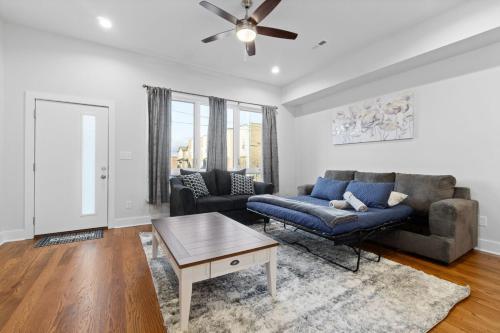 a living room with a couch and a table at Rebecca's Downtown Luxury Living (527 N 1st St, #C) in Clarksville