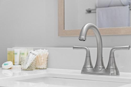 a sink with a faucet in a bathroom at Rebecca's Downtown Luxury Living (527 N 1st St, #C) in Clarksville