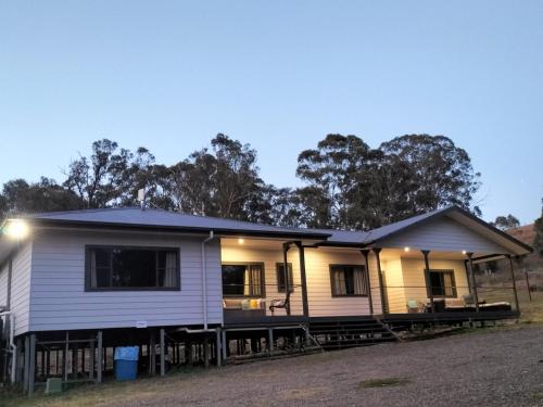 a house with a solarium on the side of it at Lambs Valley Guest House. in Lambs Valley