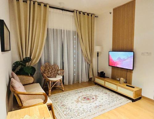 Μια τηλεόραση ή/και κέντρο ψυχαγωγίας στο MayaBay Residence, Splash Mania, Gamuda Cove by Rhguesthouse, Dengkil, near to KLIA