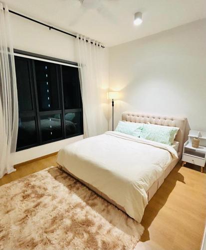 Ένα ή περισσότερα κρεβάτια σε δωμάτιο στο MayaBay Residence, Splash Mania, Gamuda Cove by Rhguesthouse, Dengkil, near to KLIA