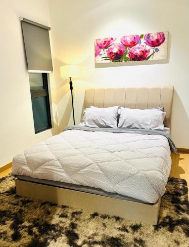 Ένα ή περισσότερα κρεβάτια σε δωμάτιο στο MayaBay Residence, Splash Mania, Gamuda Cove by Rhguesthouse, Dengkil, near to KLIA