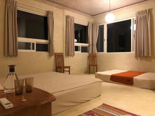 Katil atau katil-katil dalam bilik di Six Lands homestay