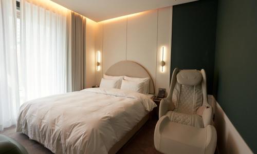 Postel nebo postele na pokoji v ubytování Brown Dot Hotel Gunsan Terminal Branch