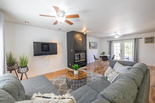 a living room with a couch and a tv at Scottsdale Orange Blossom in Scottsdale