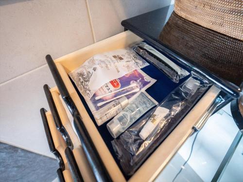 a box filled with toothbrushes and other items at Oriental Hills Okinawa in Onna