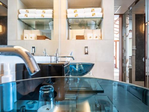 a kitchen with a sink and a counter top at Oriental Hills Okinawa in Onna