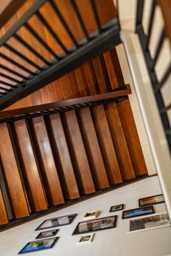 a stairway with stained glass windows on a wall at The Brown Hotel in Krabi town
