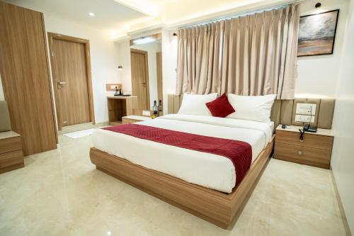 Ένα ή περισσότερα κρεβάτια σε δωμάτιο στο Hotel The Grand Murli