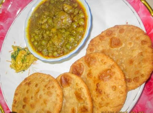 a plate of food with a bowl of soup and bread at Shivay Guest house in Jasidih