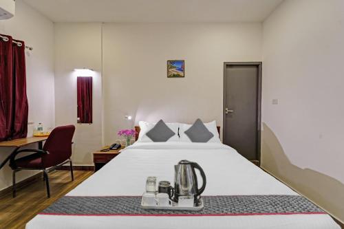 Ένα ή περισσότερα κρεβάτια σε δωμάτιο στο Townhouse ORCHID RESIDENCY Near T.Nagar