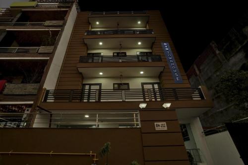 a tall building with balconies on the side of it at Townhouse Rumaisa in Noida