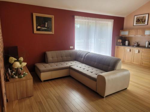 a living room with a couch and a table at Cozy Corner in Saulkrasti