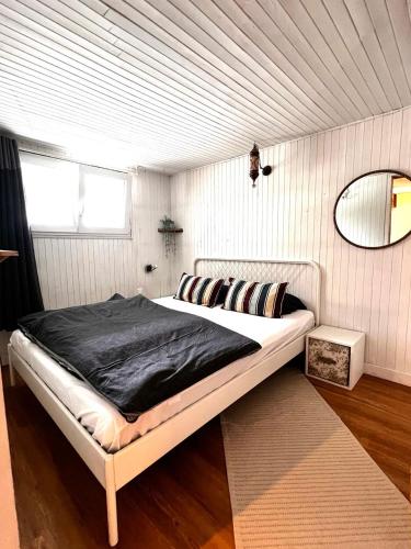 a bedroom with a large bed in a room at Appartement les Sapineaux in Courchevel