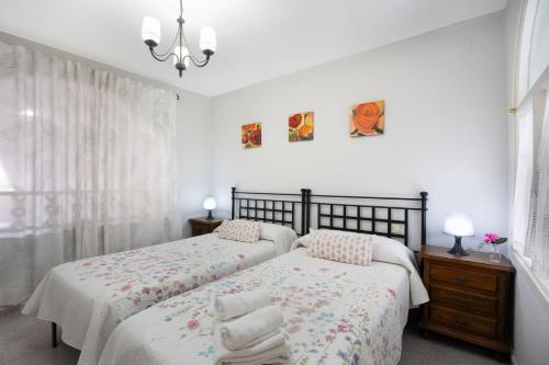 En eller flere senge i et værelse på Apartamento Arrecife D
