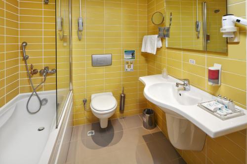 a bathroom with a sink and a toilet and a shower at Pam Thermal Hotel Clinic & Spa in Pamukkale