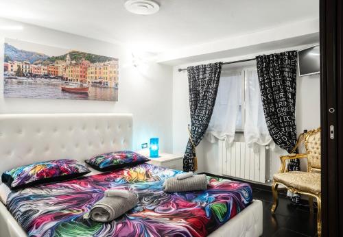 a bedroom with a bed and a window at Spinola Palace Apartment in Genoa
