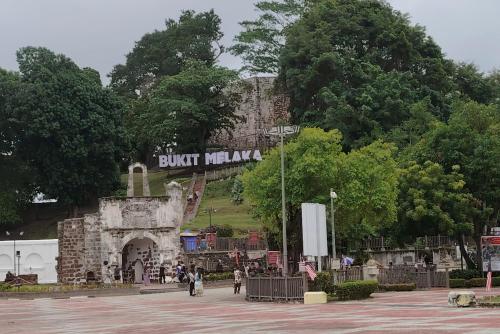a building with a sign that reads buff melka at Cozy Home 3BR 8pax The Prive Malacca Jonker Street in Melaka