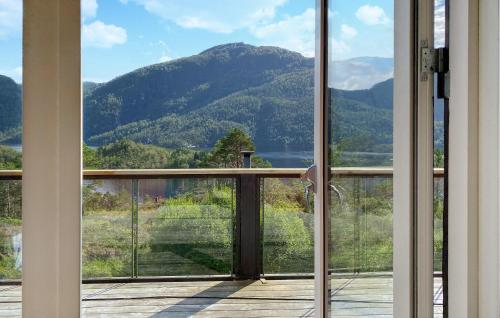 a view of a mountain from the balcony of a house at 3 Bedroom Nice Home In Florø in Florø
