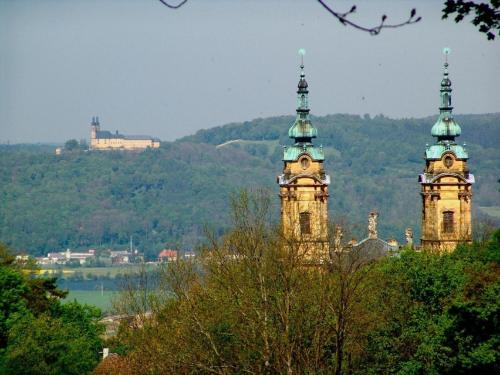 two towers with clocks on top of a building at Ferienwohnung Frankenliebe in Bad Staffelstein