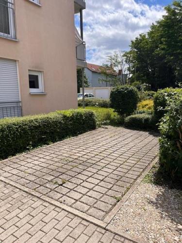 a brick walk way in front of a house at Ferienwohnung Frankenliebe in Bad Staffelstein
