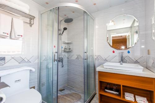 a bathroom with a shower and a sink at 桂林依庐居民宿 in Guilin