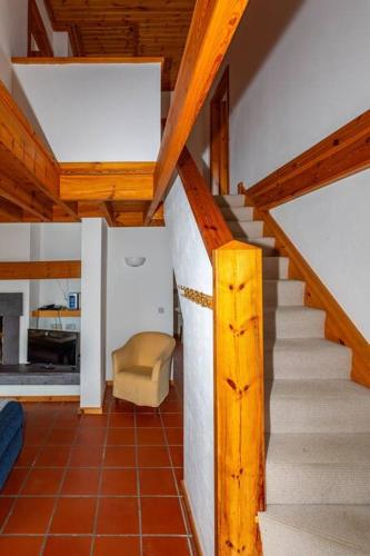 a staircase in a house with a stair case at Beautiful home on Ring of Kerry in Waterville